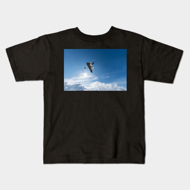 Snowboarder jumping against blue sky Kids T-Shirt by homydesign